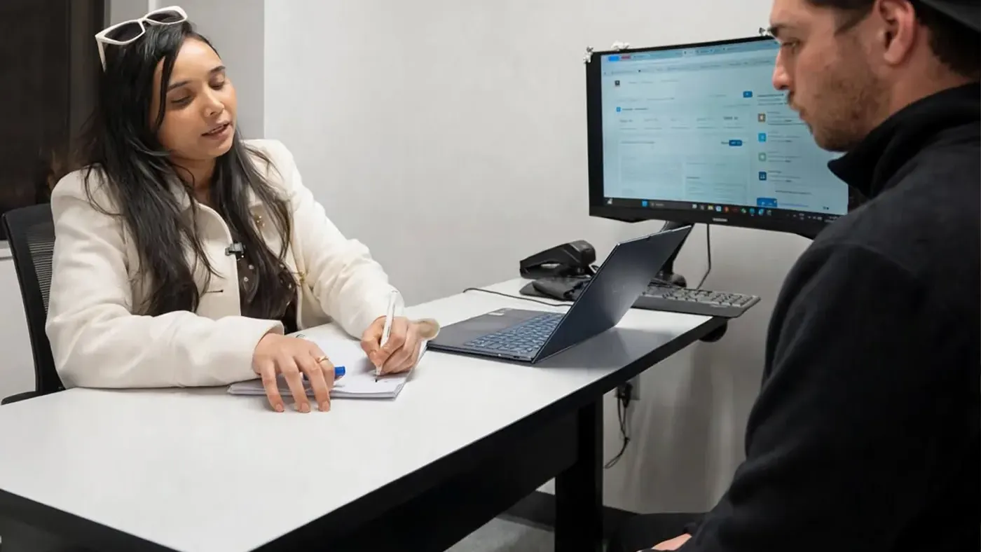 IELTS and PTE score evaluation, Boston Institute A Boston Institute adviser reviewing a student's IELTS and PTE goals in a one-on-one session in Sydney