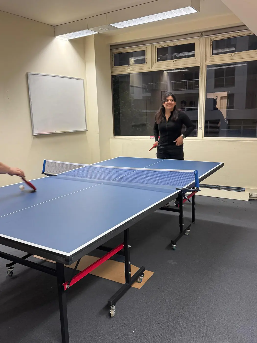 Playing a point, 2025 Students playing a point at the Boston Institute table tennis table