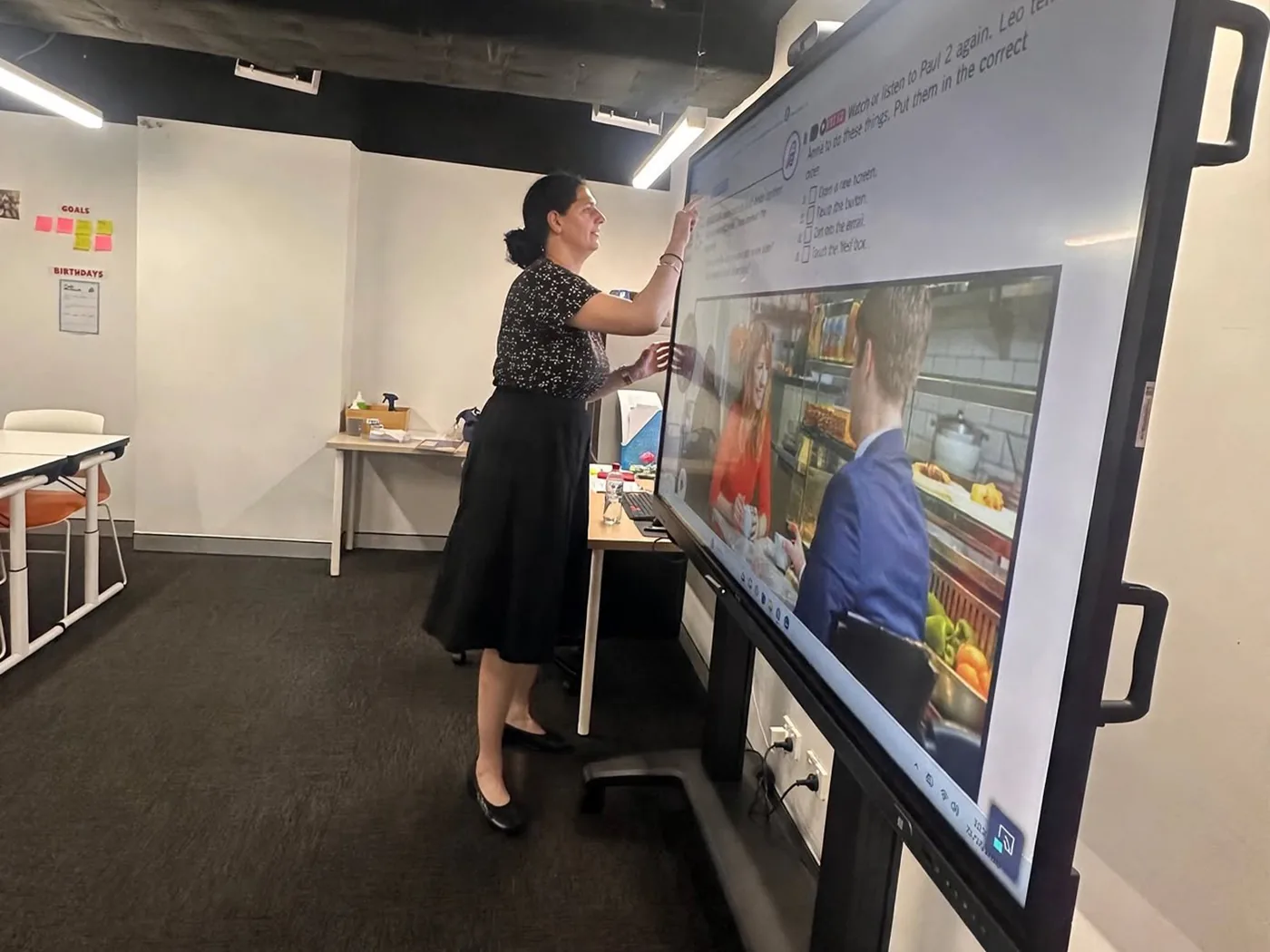 Interactive display lesson A teacher using a large interactive display during a lesson at Boston Institute