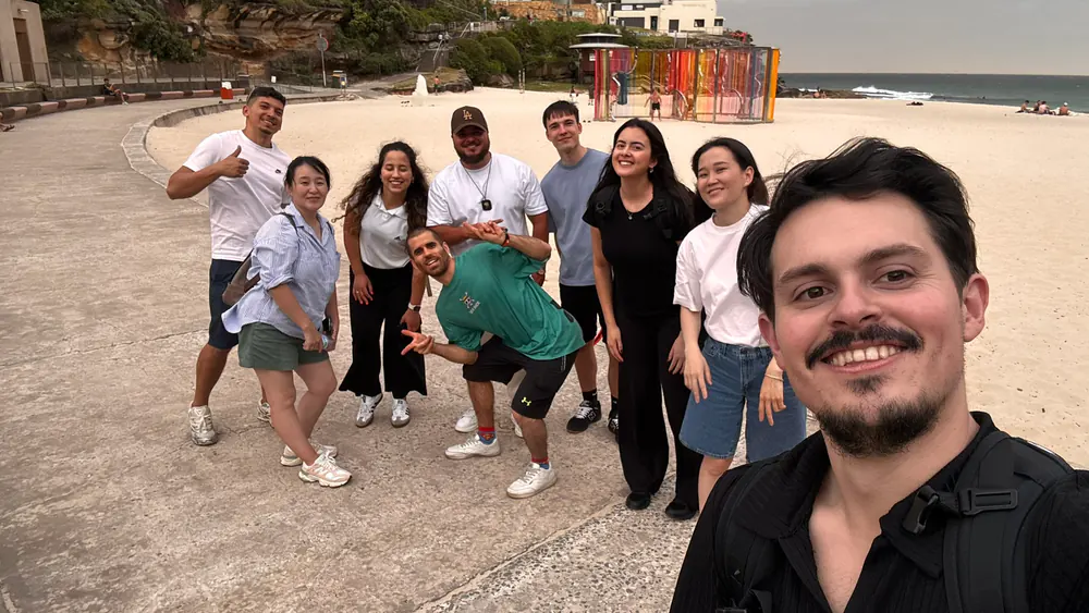 Beach promenade photo Group of Boston Institute students posing on a Sydney beach promenade