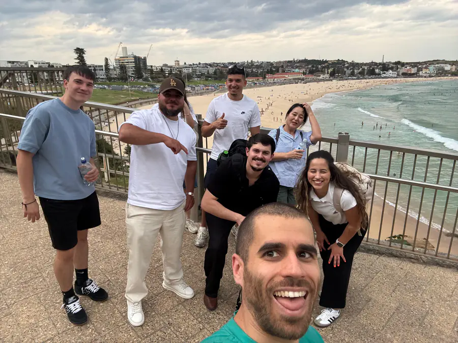 Bondi Beach class group Boston Institute class gathered at the Bondi Beach railing