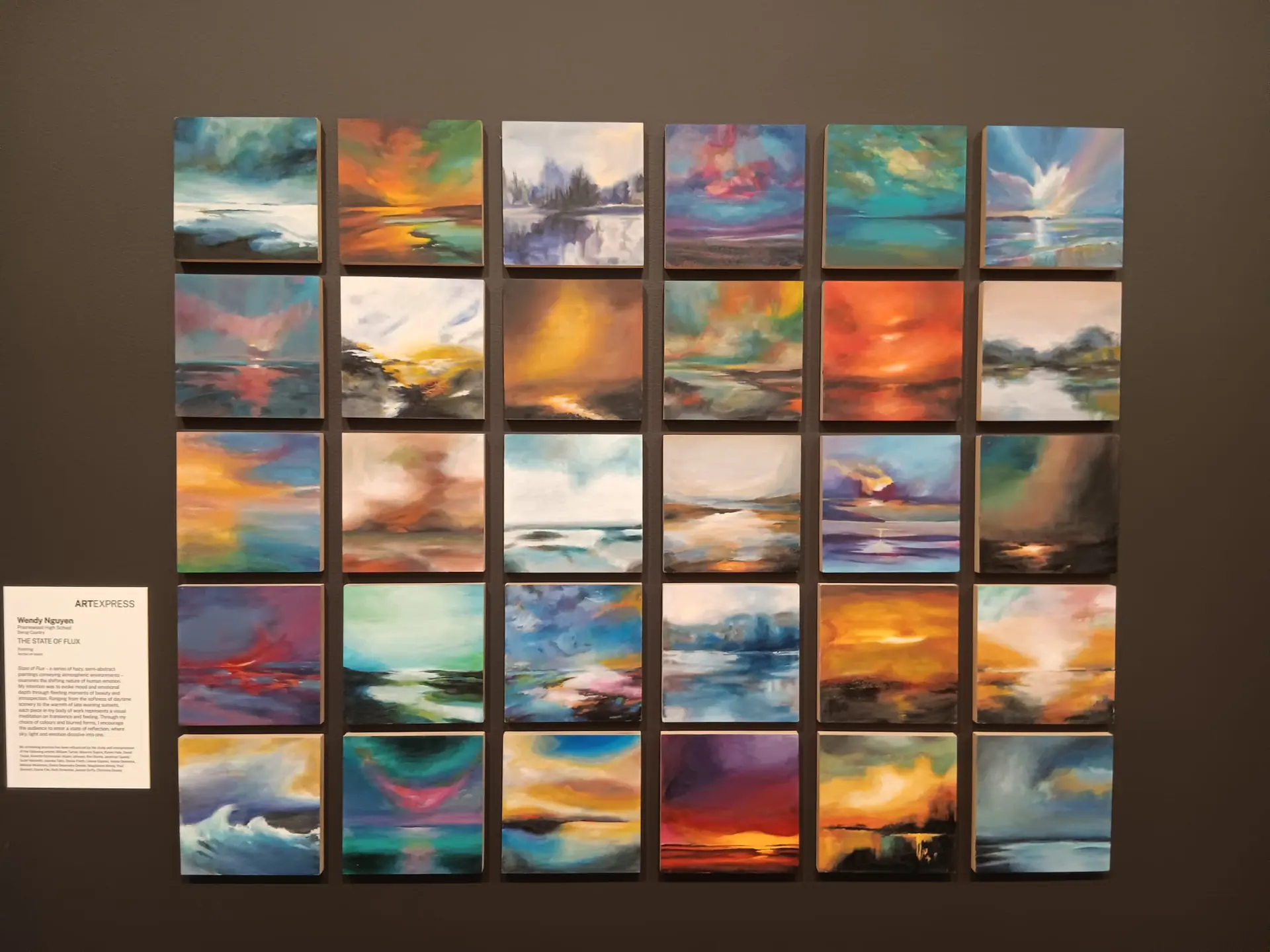 Painting grid display Grid of small landscape paintings on a gallery wall in Sydney