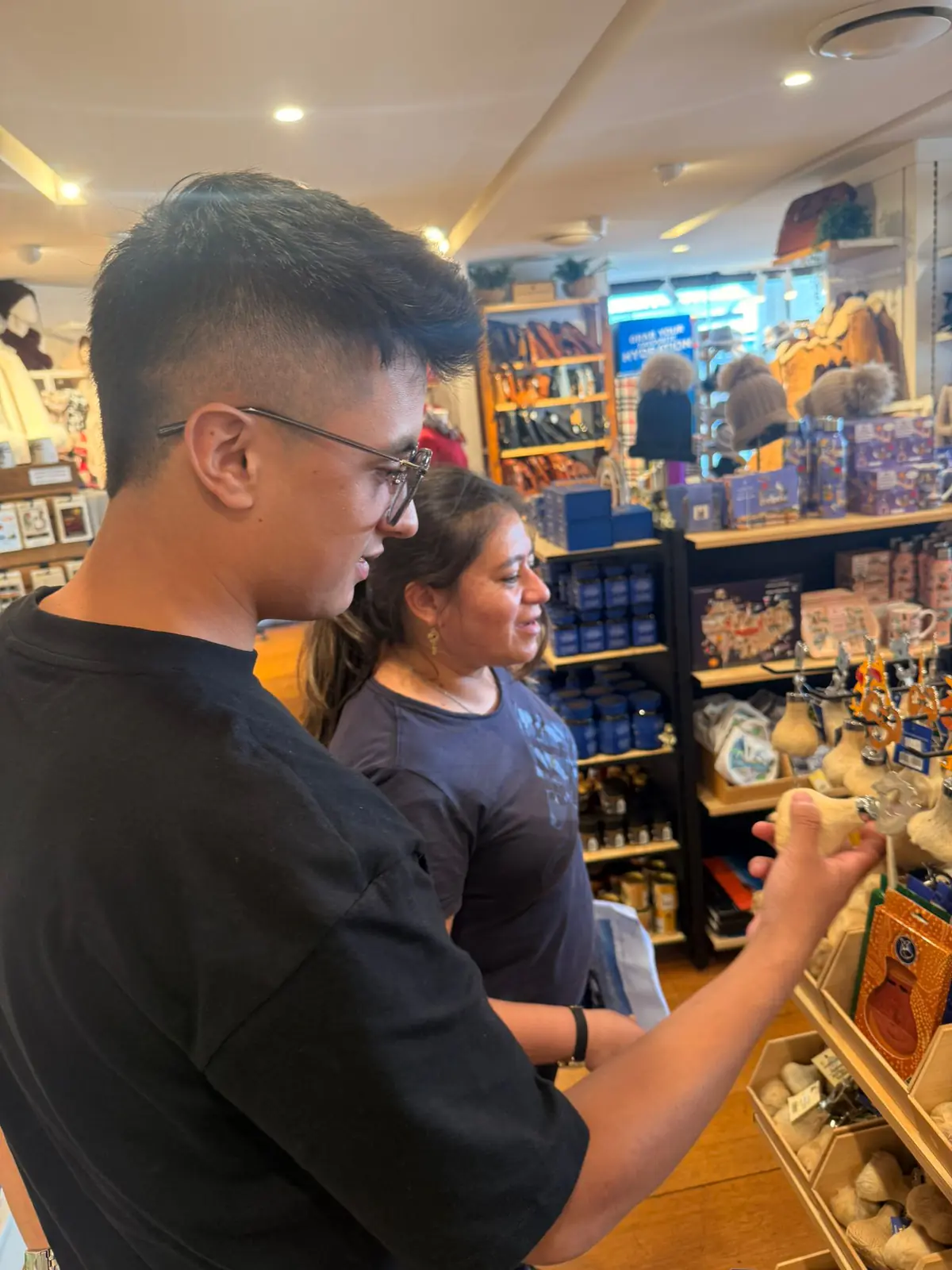 Souvenir shop visit Two Boston Institute students browsing a Sydney souvenir shop on an excursion