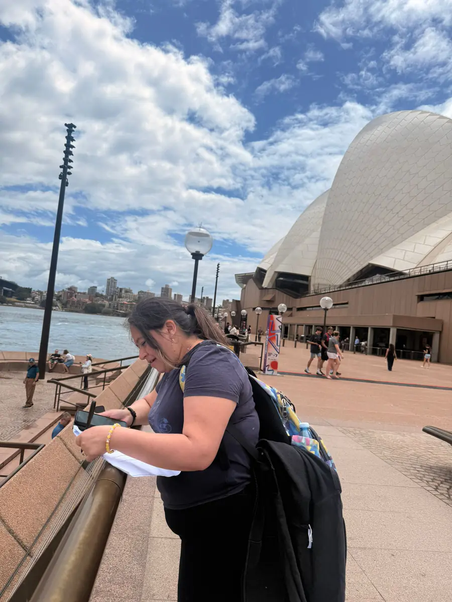 Sydney Opera House excursion Boston Institute student photographing the Sydney Opera House during a class excursion