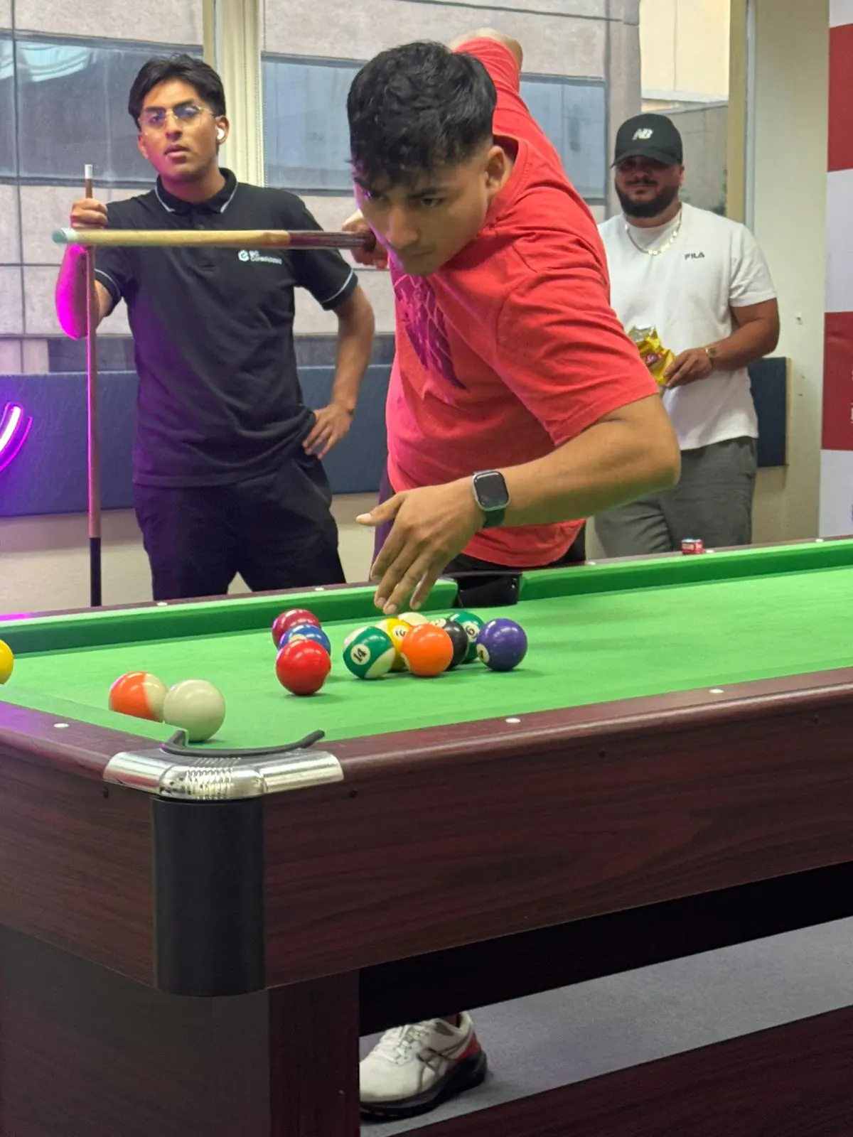 Pool tournament, 2025 Student taking a shot at the Boston Institute pool tournament in Sydney