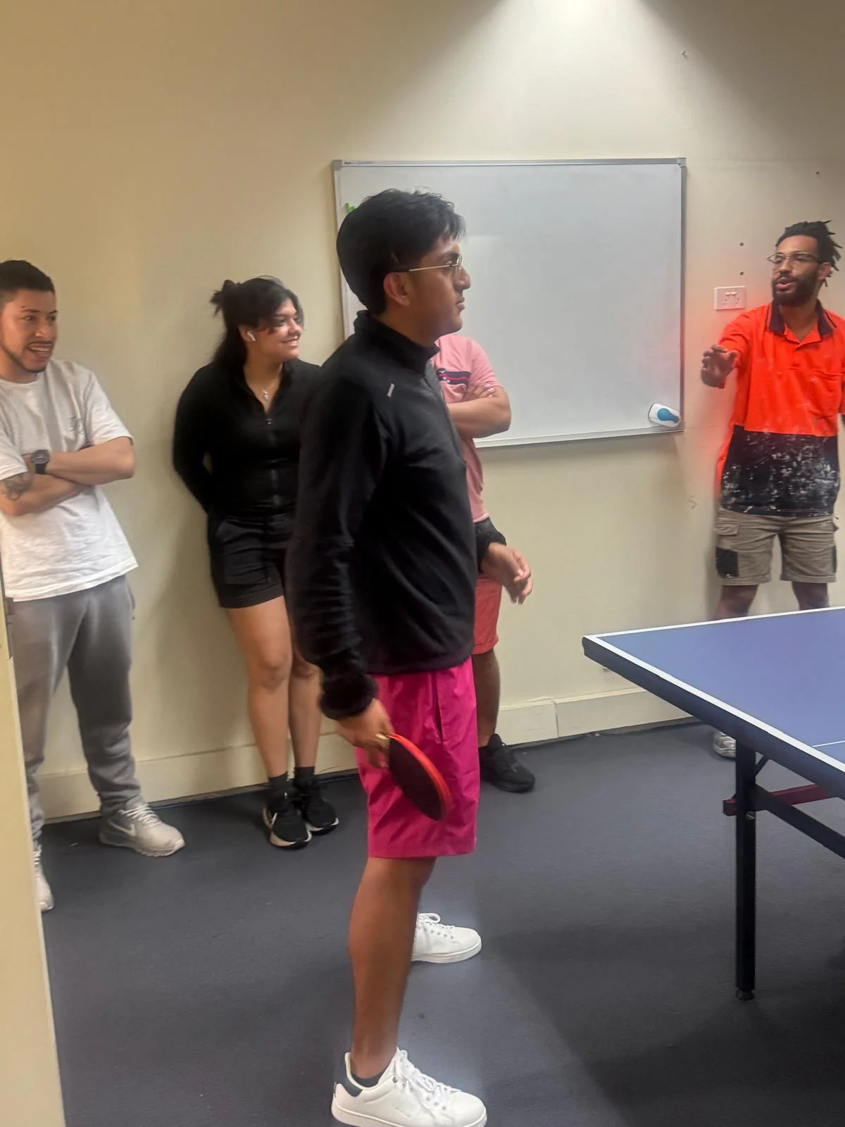 Watching the match, 2025 Boston Institute students watching a table tennis match from the sidelines
