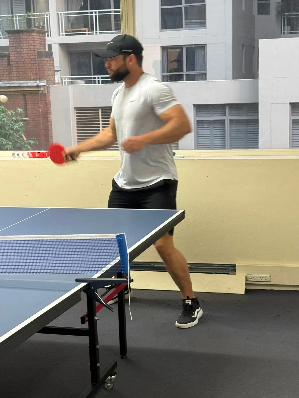 Backhand shot, 2025 Student playing a backhand shot in a Boston Institute table tennis match