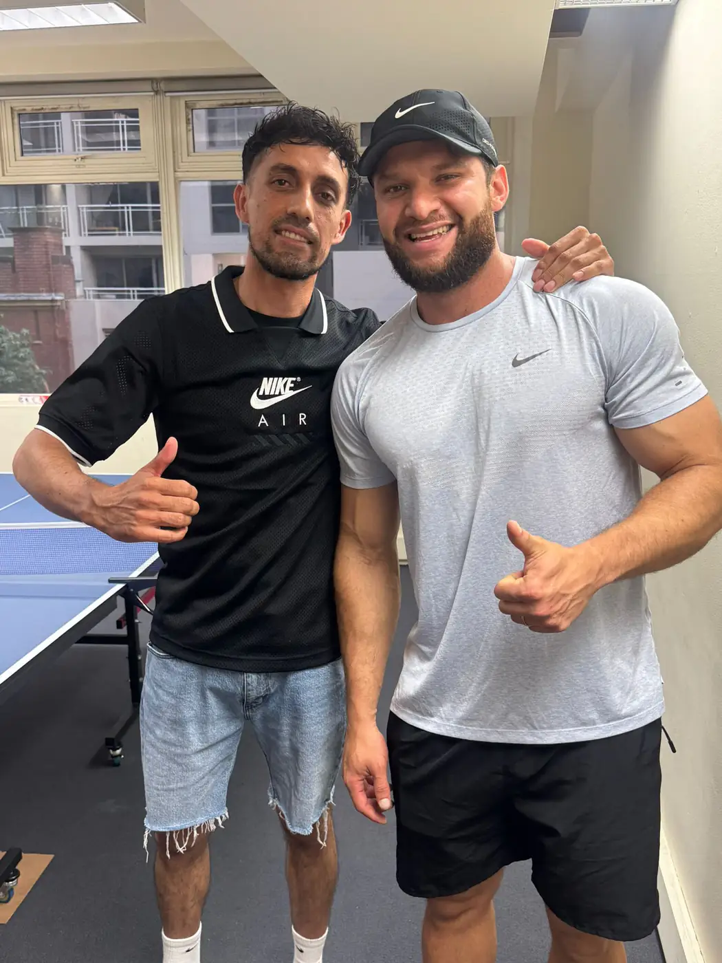 Table tennis finalists, 2025 Two table tennis finalists posing together at Boston Institute