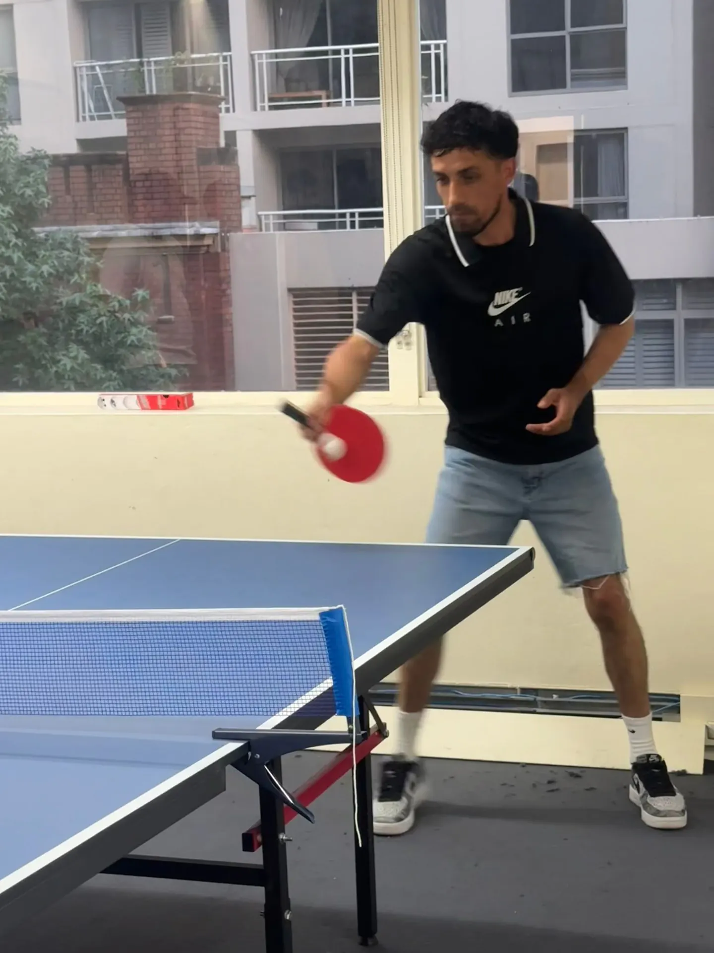 Table tennis smash, 2025 Student playing a smash shot during a table tennis match