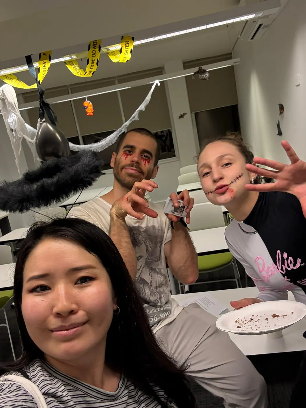 Party selfie, Halloween 2025 Students taking a selfie at the Halloween party food table