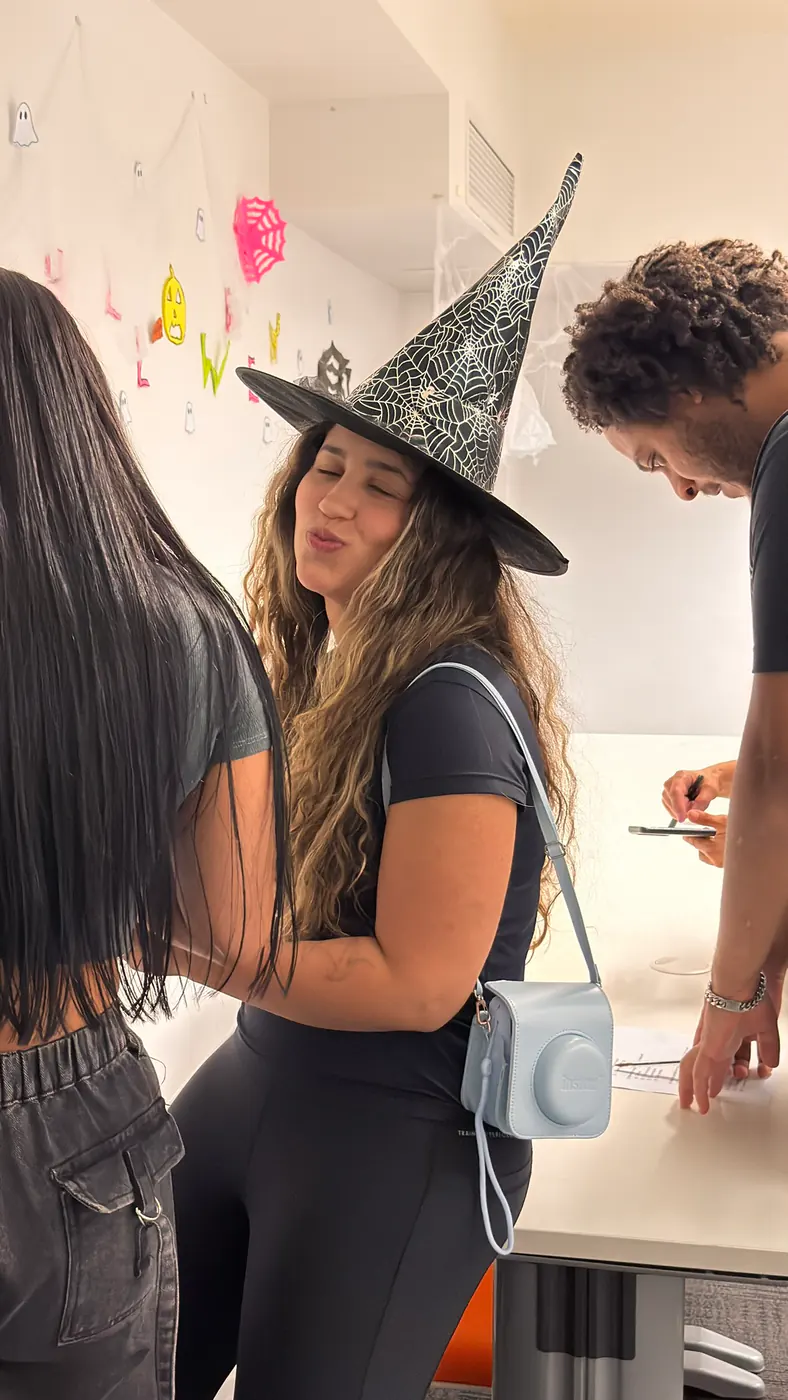 Witch hat costume, Halloween 2025 Student wearing a witch hat during the Boston Institute Halloween party