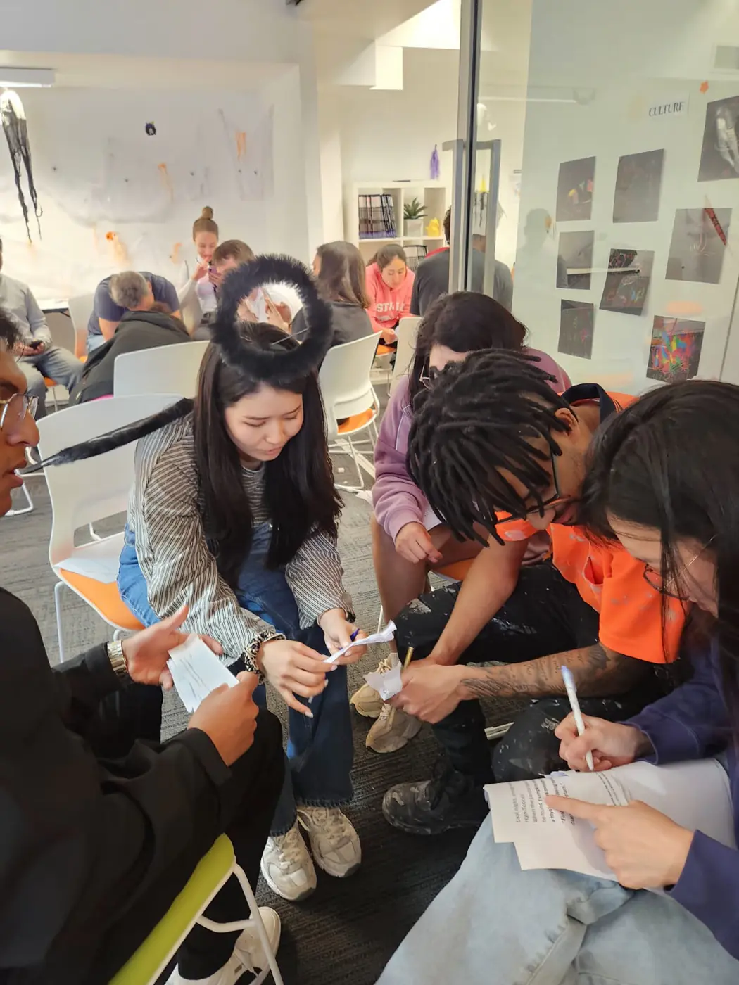 Halloween group activity, 2025 Boston Institute students working together on a Halloween themed group activity