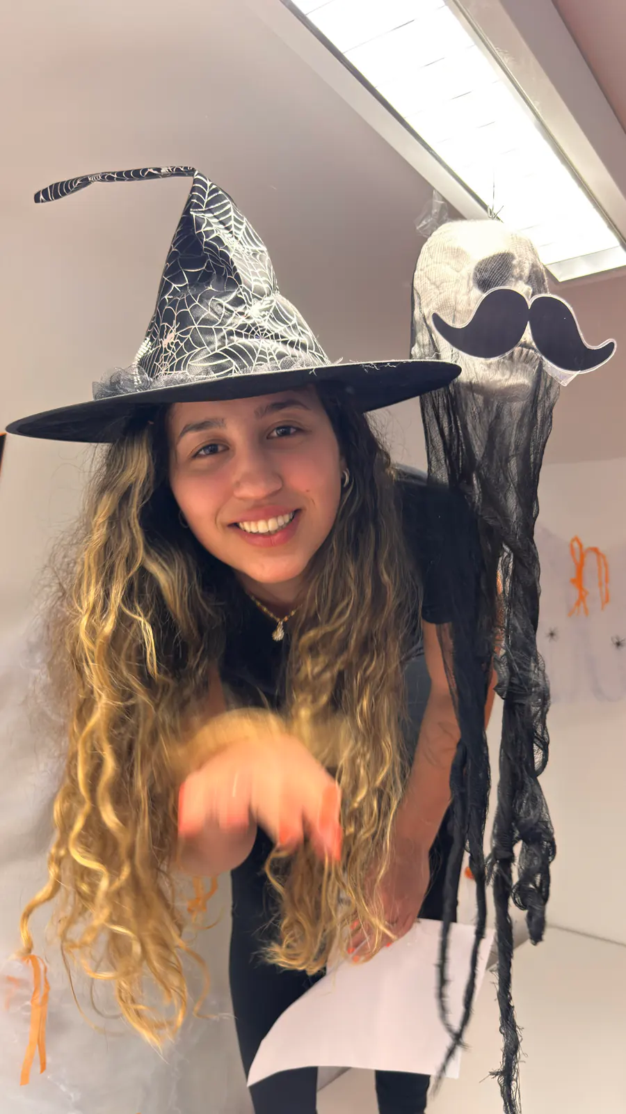 Witch costume portrait, Halloween 2025 Portrait of a Boston Institute student wearing a witch hat and Halloween wig